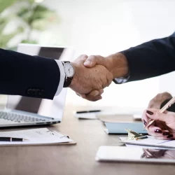 Business people shaking hands together